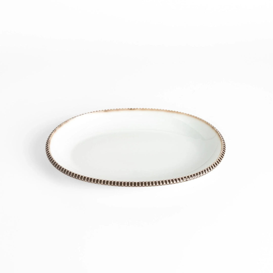 Classic white dinner plate with a unique beaded design, ideal for everyday dining or special occasions.