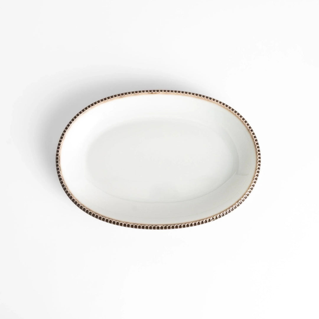 Classic white dinner plate with a unique beaded design, ideal for everyday dining or special occasions.