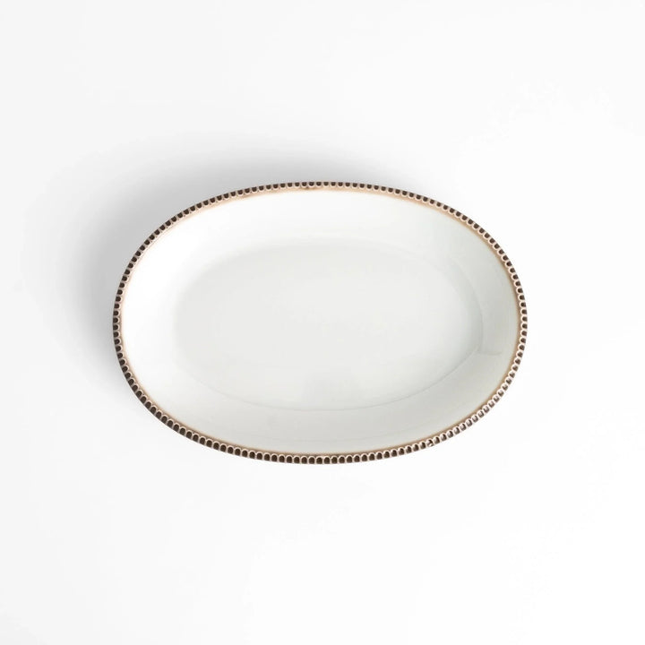 Classic white dinner plate with a unique beaded design, ideal for everyday dining or special occasions.