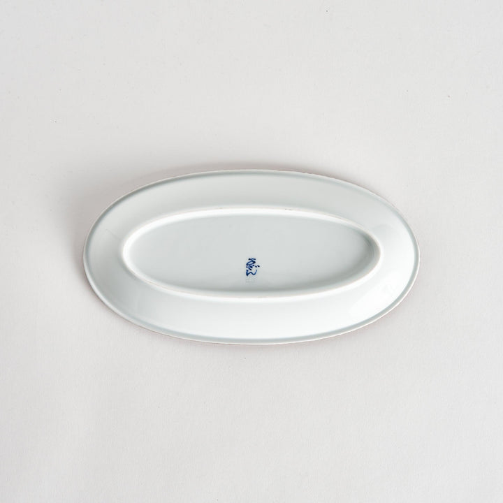 Back view of the oval salad plate, displaying the plain white underside.