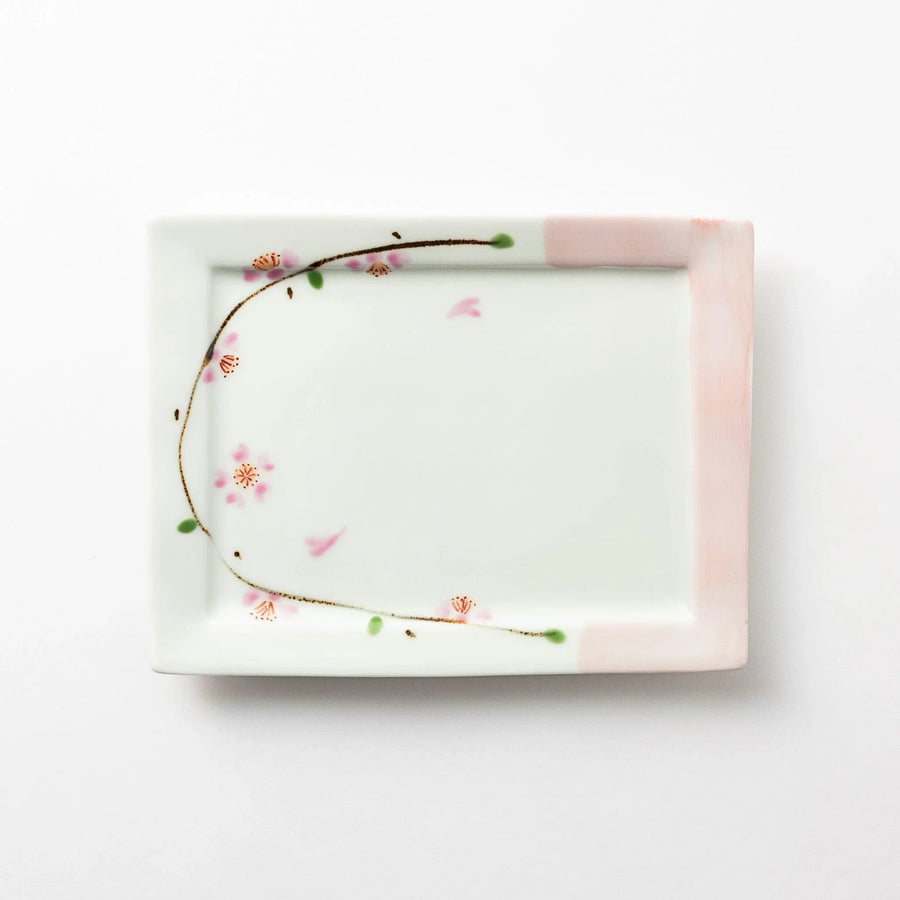 Rectangular dessert plate with a delicate cherry blossom design, featuring soft pink and green accents along the edges.