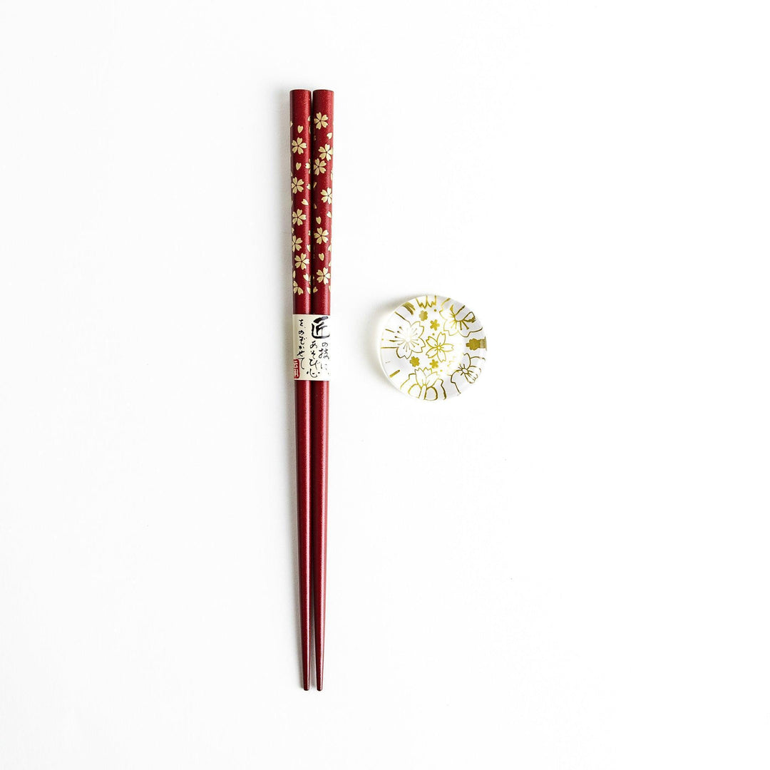 Red lacquer chopsticks with sakura patterns. Available in black or red.