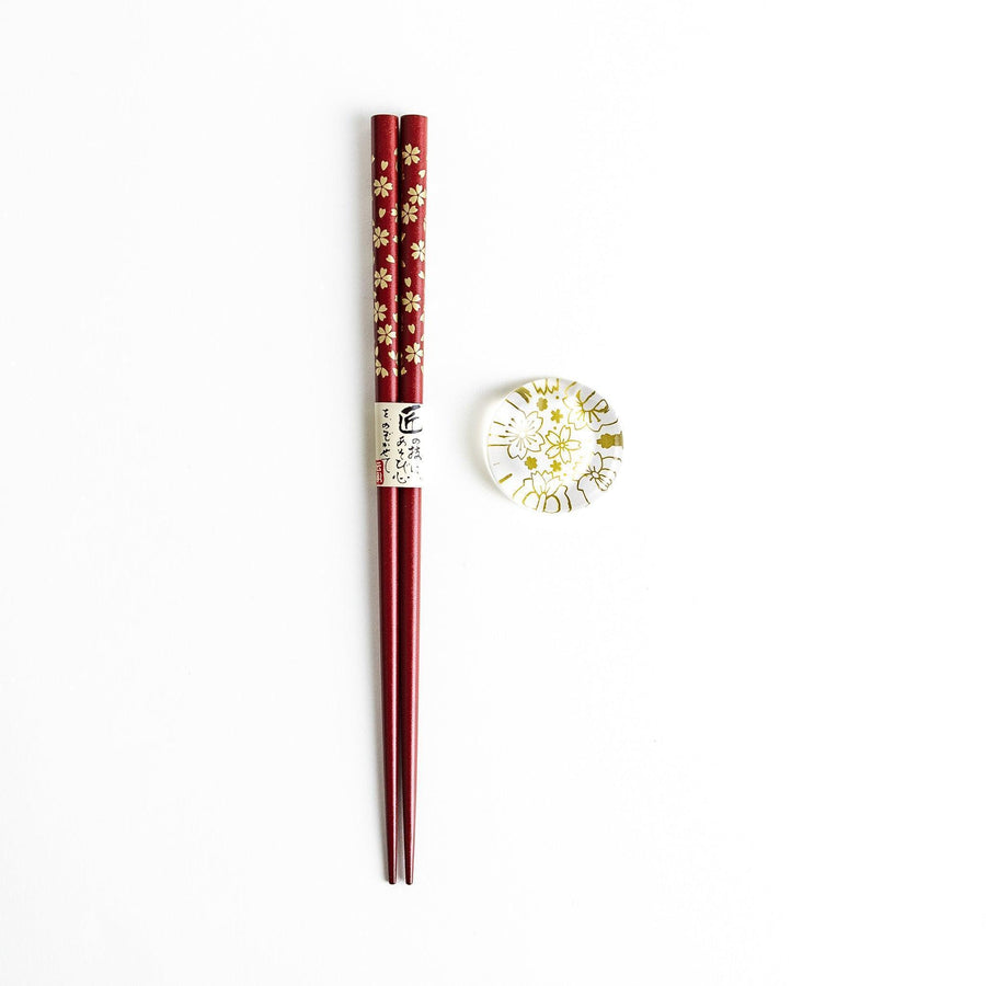 Red lacquer chopsticks with sakura patterns. Available in black or red.