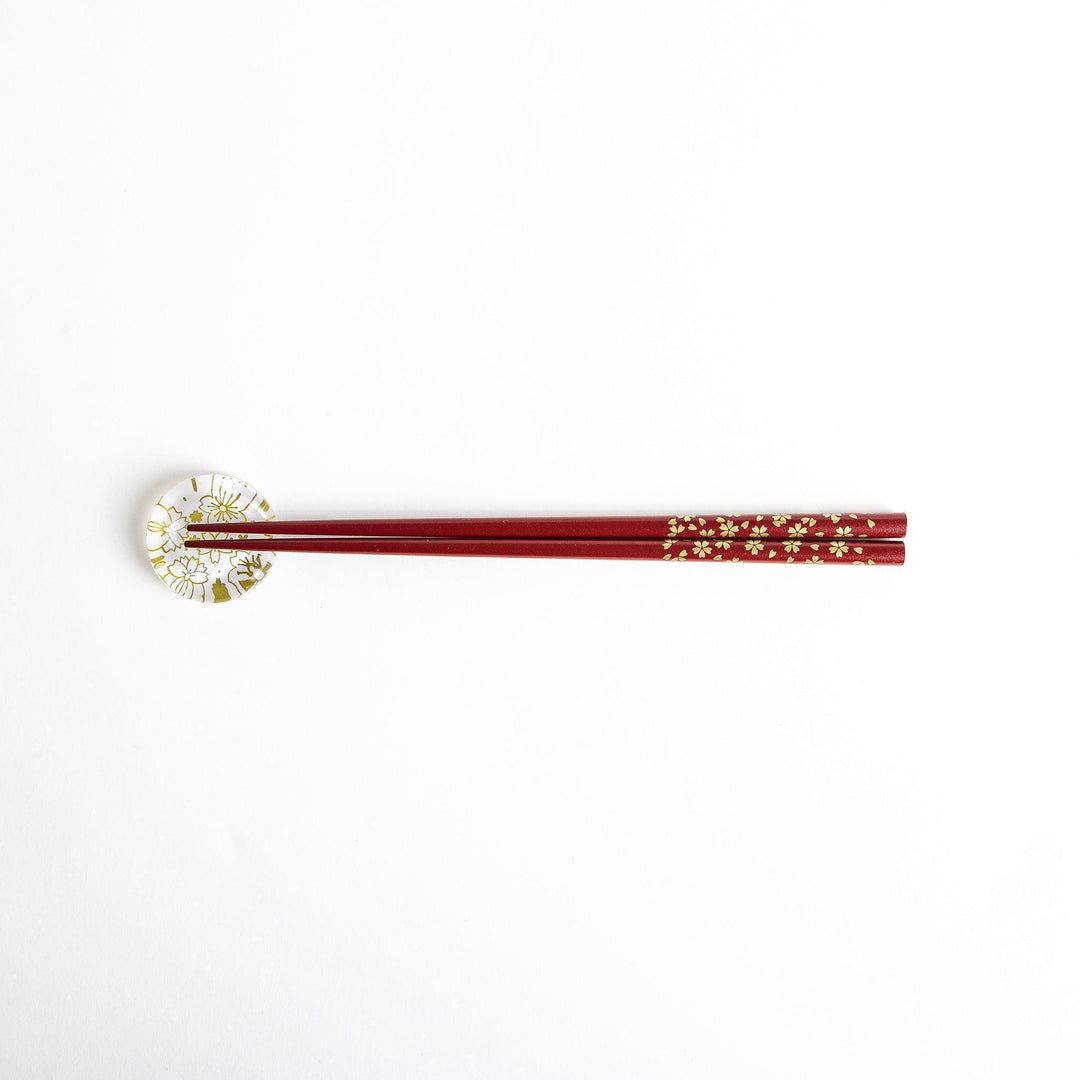 Red lacquer chopsticks with sakura patterns. Available in black or red.