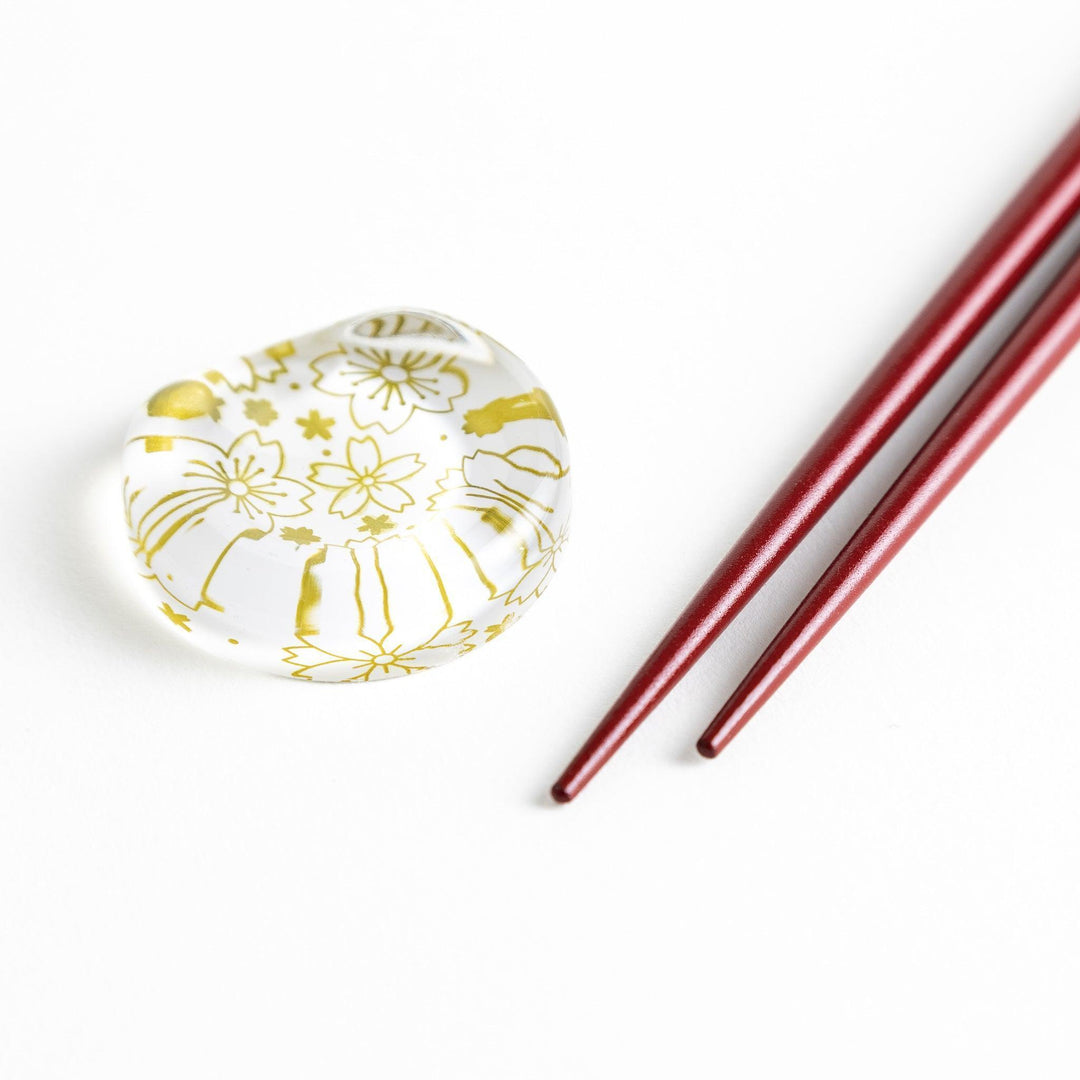 Red lacquer chopsticks with sakura patterns. Available in black or red.