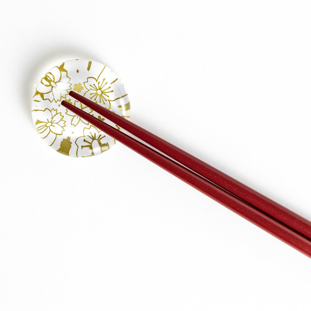 Red lacquer chopsticks with sakura patterns. Available in black or red.