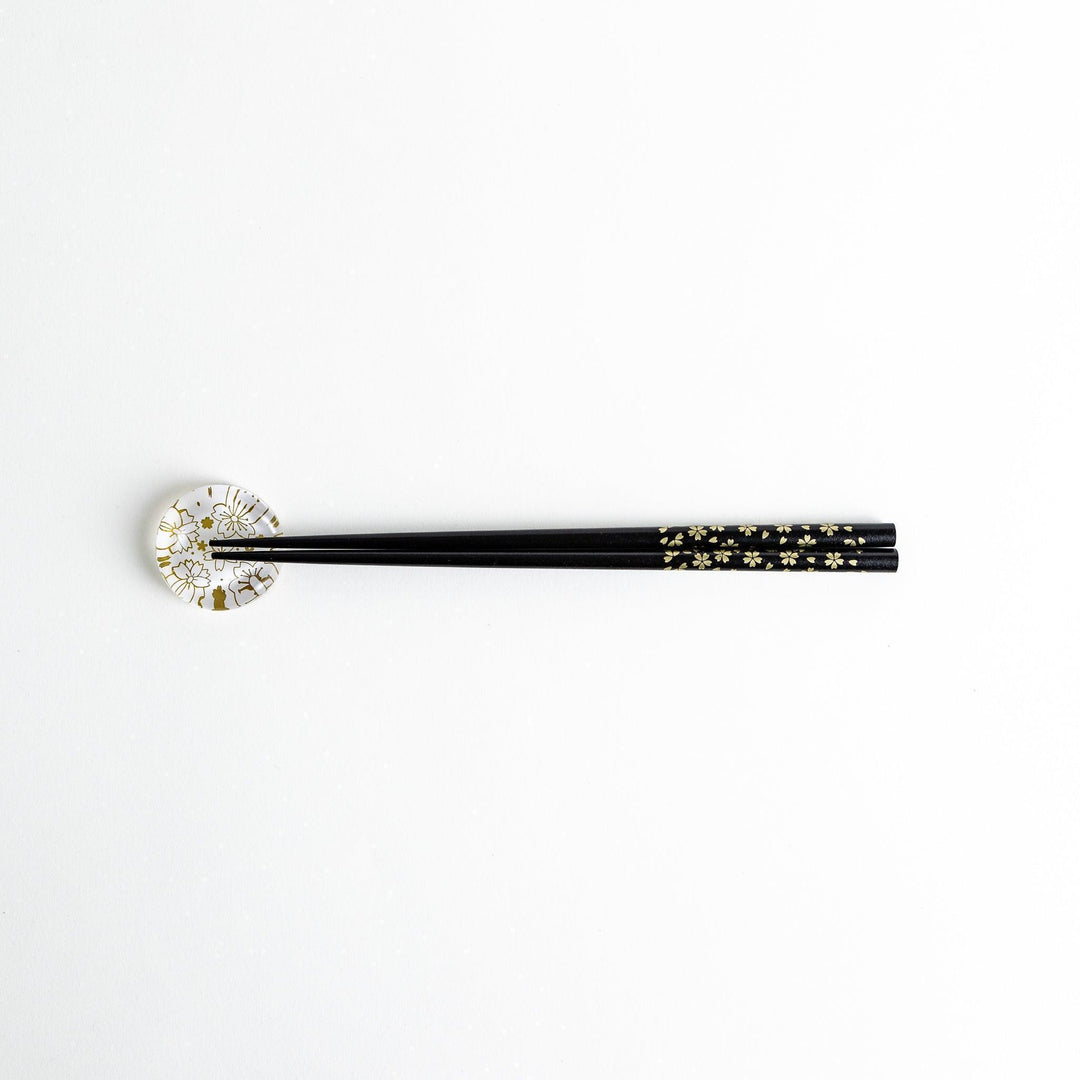Red lacquer chopsticks with sakura patterns. Available in black or red.