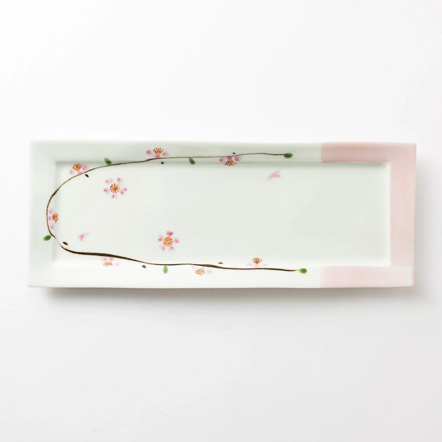 Rectangular cherry blossom plate with pink accents and delicate floral design on white porcelain.