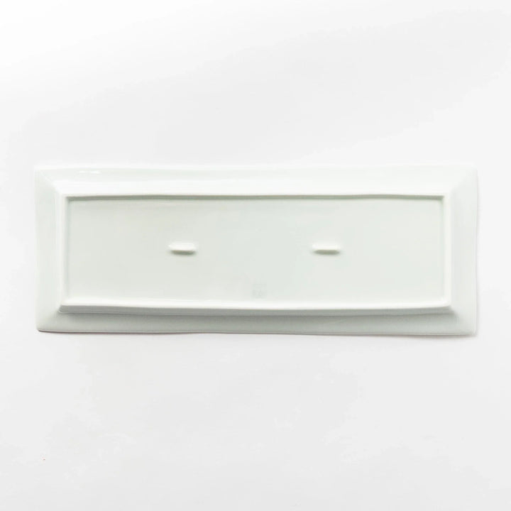 Back view of a rectangular plate, entirely white, showcasing its clean and simple base design.