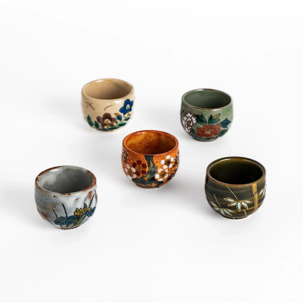 Set of five Sake Cups featuring seasonal blossom designs, perfect for enjoying your favorite sake.