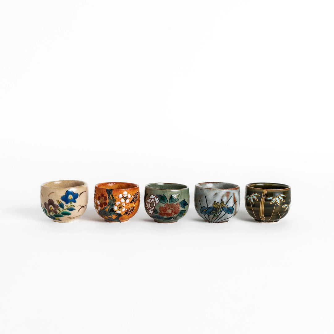 Set of five Sake Cups featuring seasonal blossom designs, perfect for enjoying your favorite sake.
