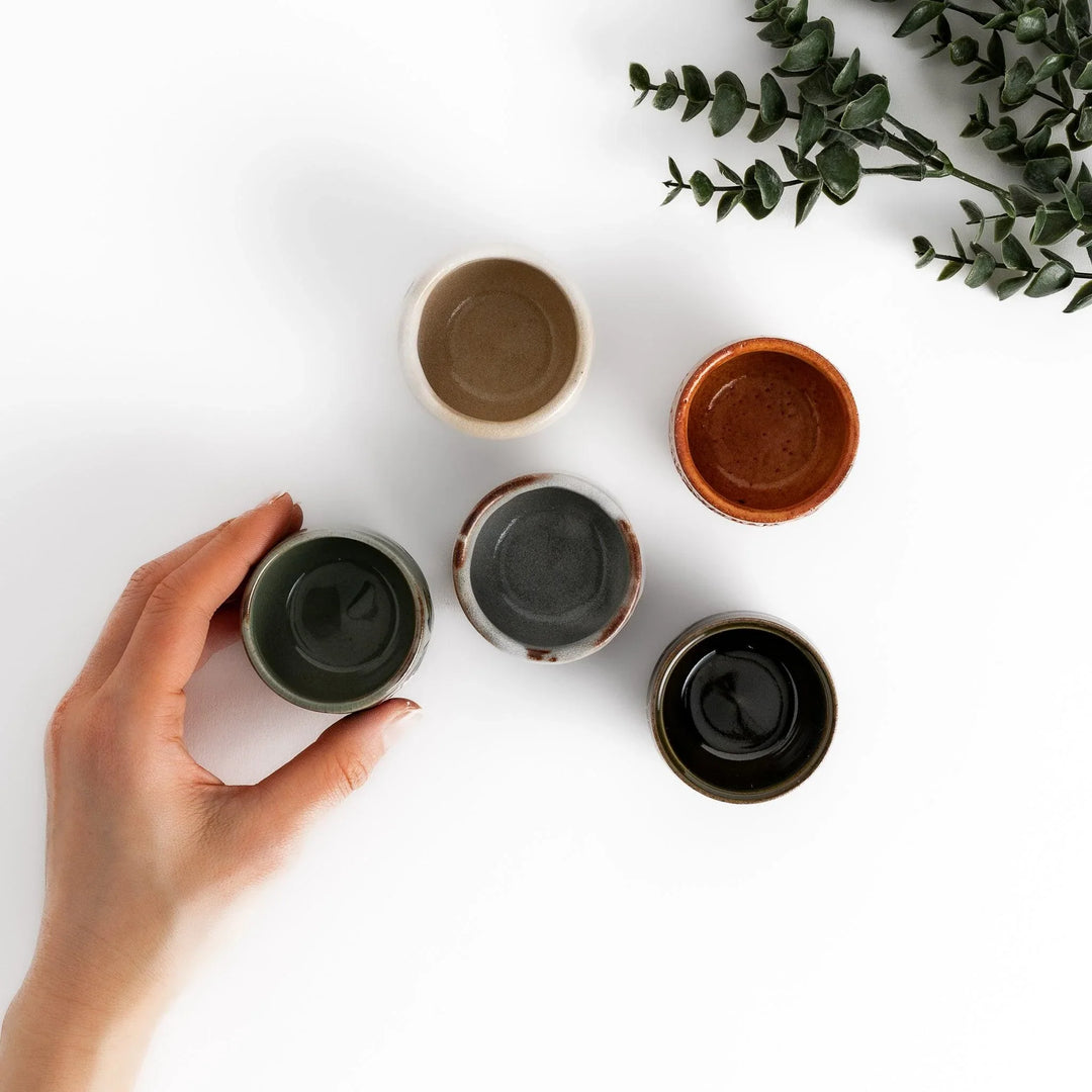 Set of five Sake Cups featuring seasonal blossom designs, perfect for enjoying your favorite sake.