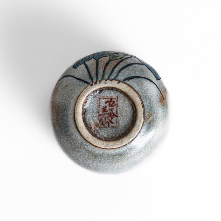 Set of five Sake Cups featuring seasonal blossom designs, perfect for enjoying your favorite sake.