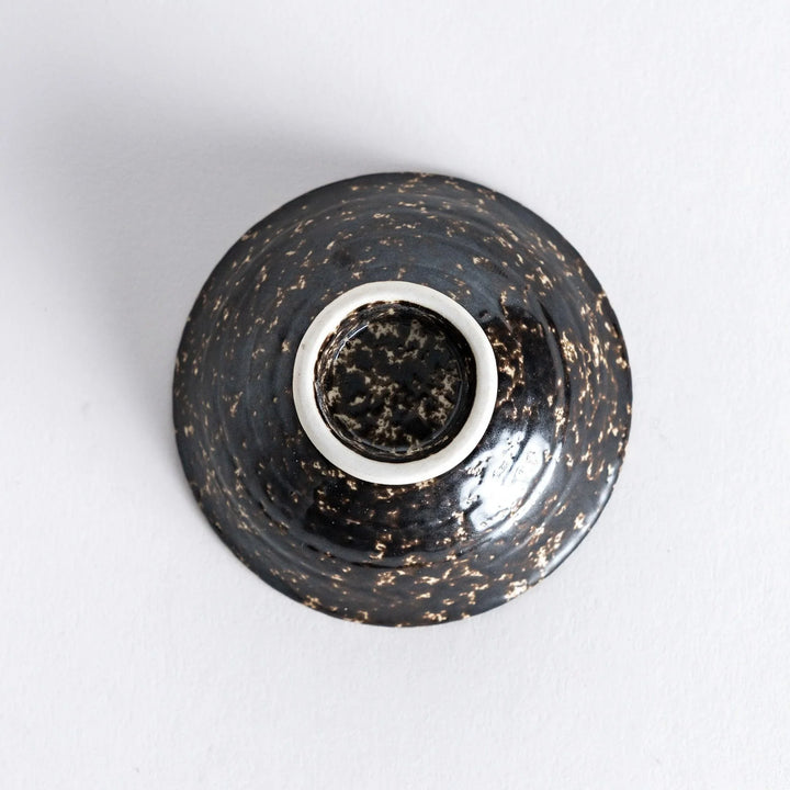 Bottom view of the silver rustic finish sake cup, revealing its smooth base with subtle texture around the edge.