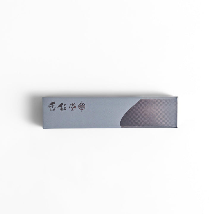 Gray Japanese box with calligraphy and checkered design packaging a minimalist functional incense holder.