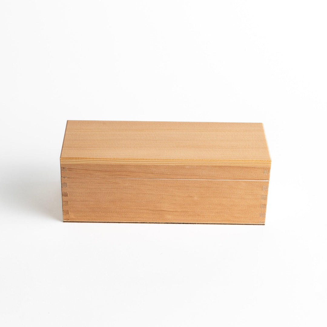 Small wooden katsuobushi shaver box with sliding drawer and lid and colorful Japanese artwork packaging.
