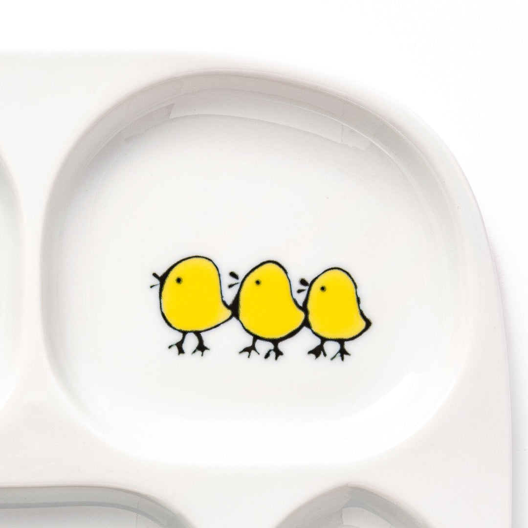 Kids’ plate featuring two snowbirds and three yellow chicks with blue accents, perfect for cheerful mealtime.