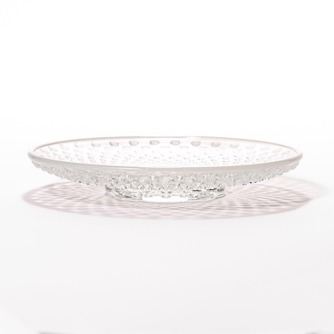 Clear glass dessert bowl and saucer with raised dots and starburst base, perfect for elegant desserts or fruit.