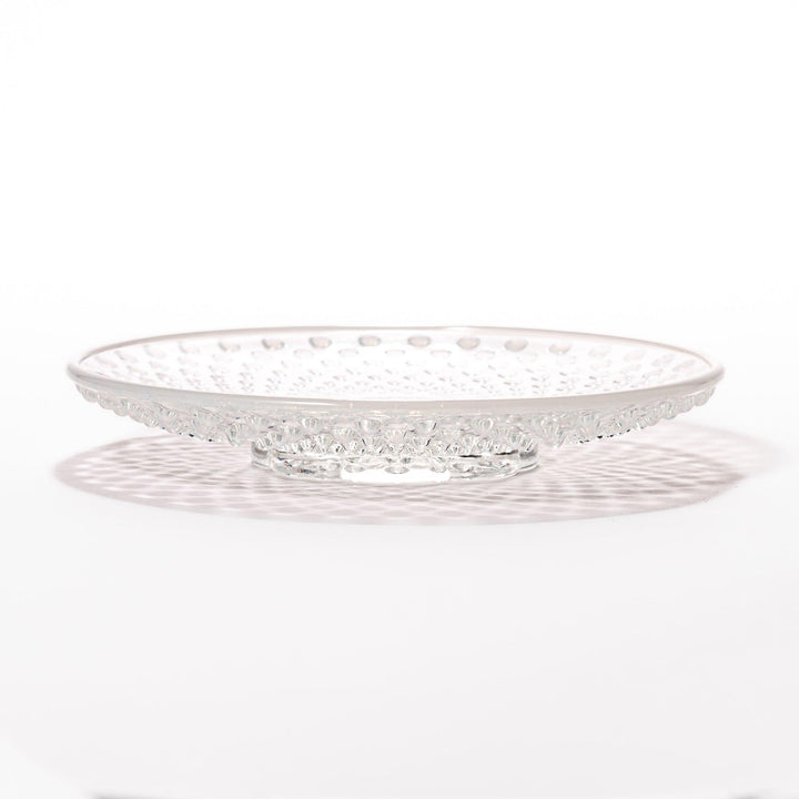 Clear glass dessert bowl and saucer with raised dots and starburst base, perfect for elegant desserts or fruit.