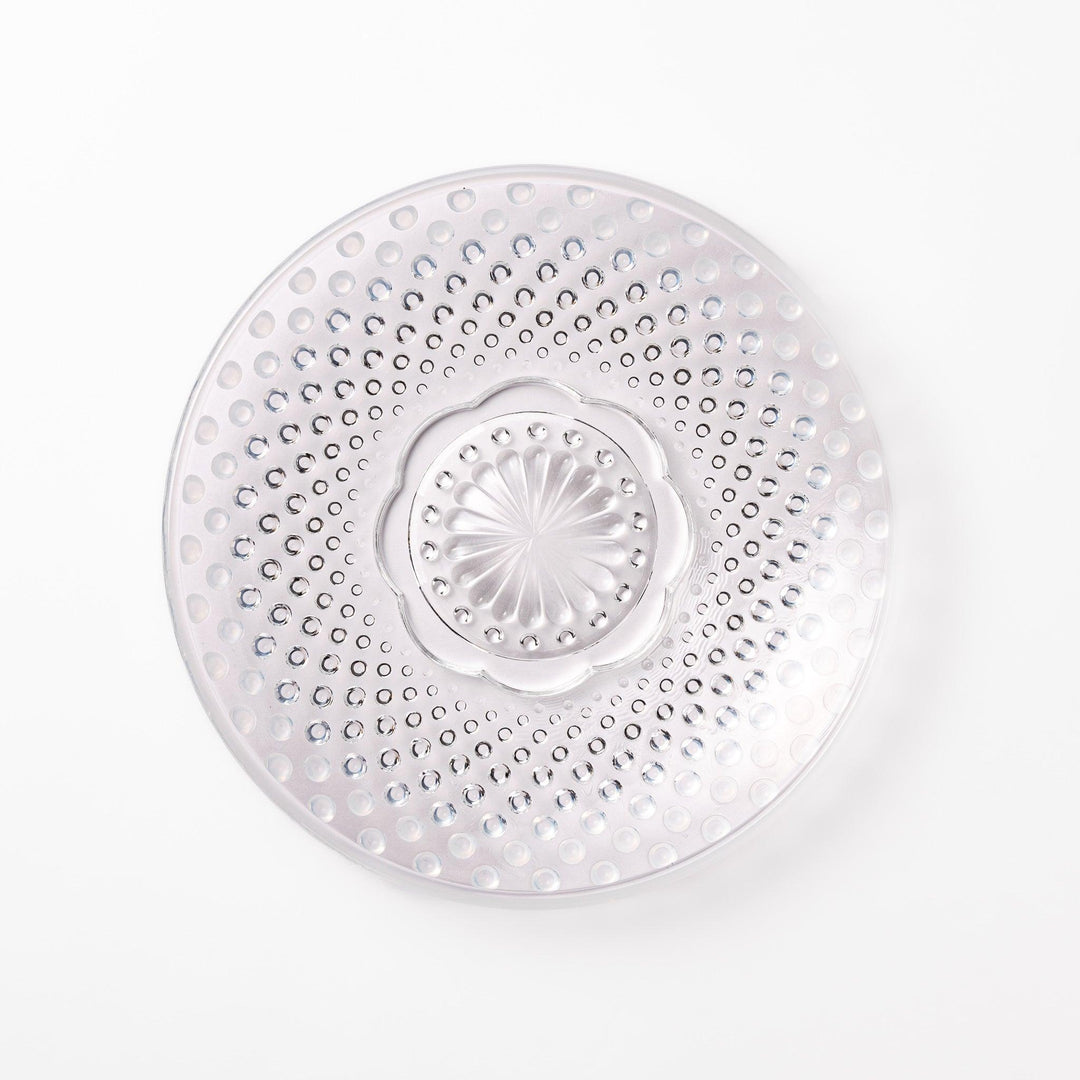 Clear glass dessert bowl and saucer with raised dots and starburst base, perfect for elegant desserts or fruit.