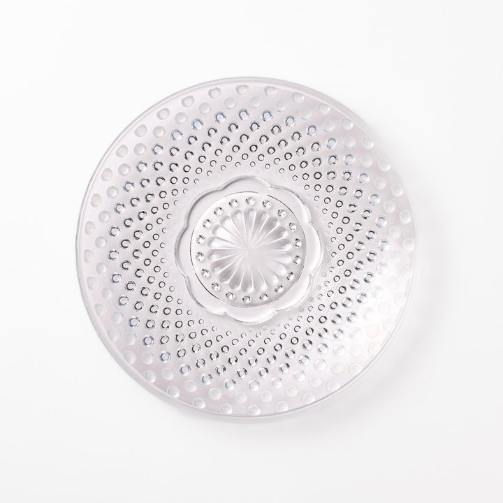 Clear glass dessert bowl and saucer with raised dots and starburst base, perfect for elegant desserts or fruit.
