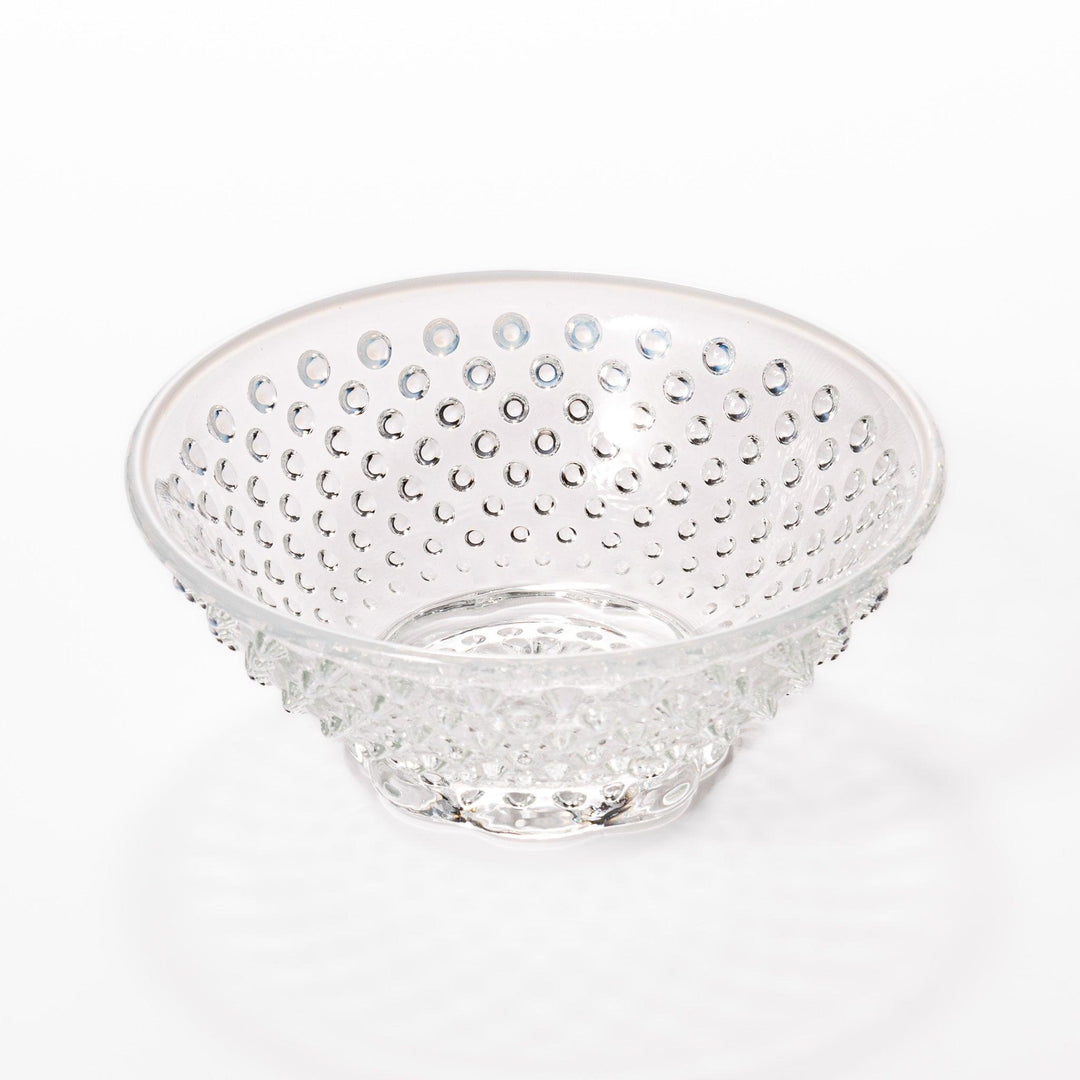 Clear glass dessert bowl and saucer with raised dots and starburst base, perfect for elegant desserts or fruit.