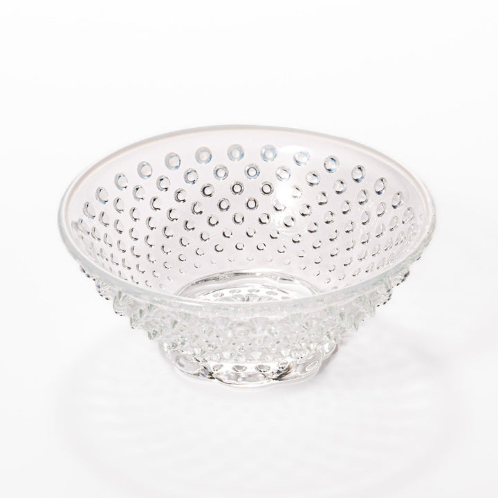 Clear glass dessert bowl and saucer with raised dots and starburst base, perfect for elegant desserts or fruit.