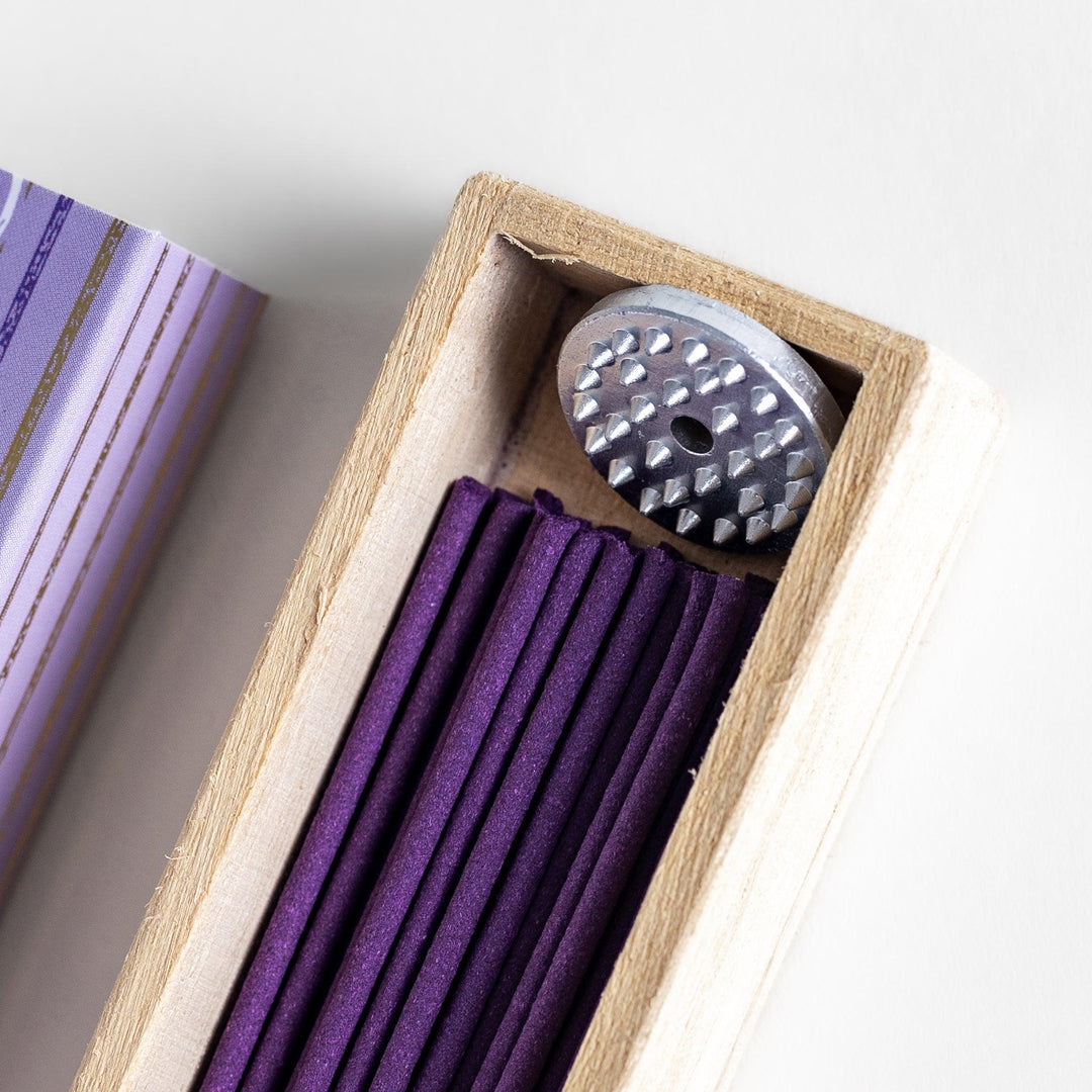 Japanese lavender incense in wooden box with purple sticks and white circle pattern design for relaxing aroma.