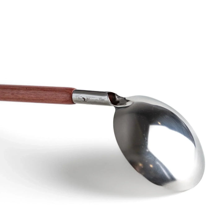 Durable wooden and stainless steel ladle, essential kitchenware for cooking.
