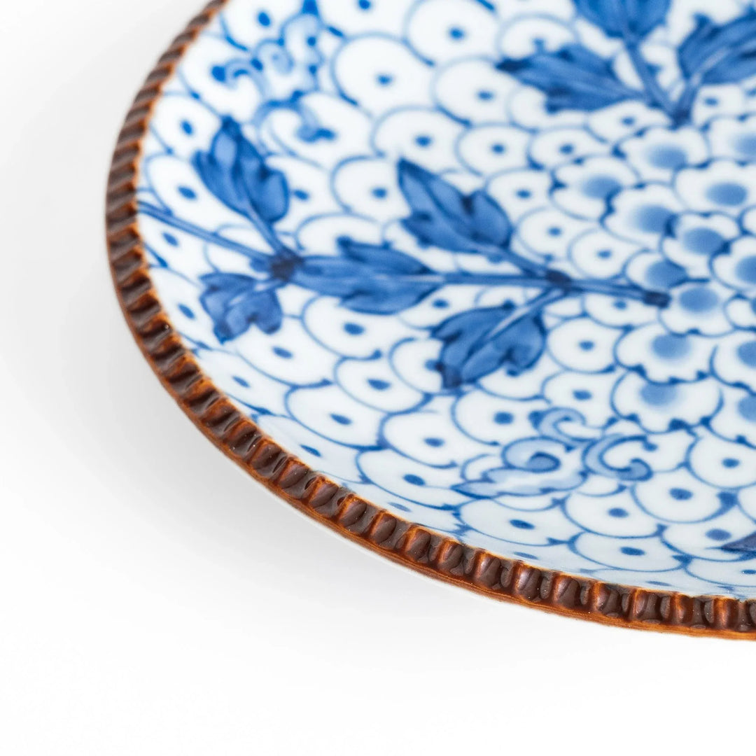 Dessert Plate featuring a beautiful blue spotted floral design with a delicate, beaded rim for an elegant touch.