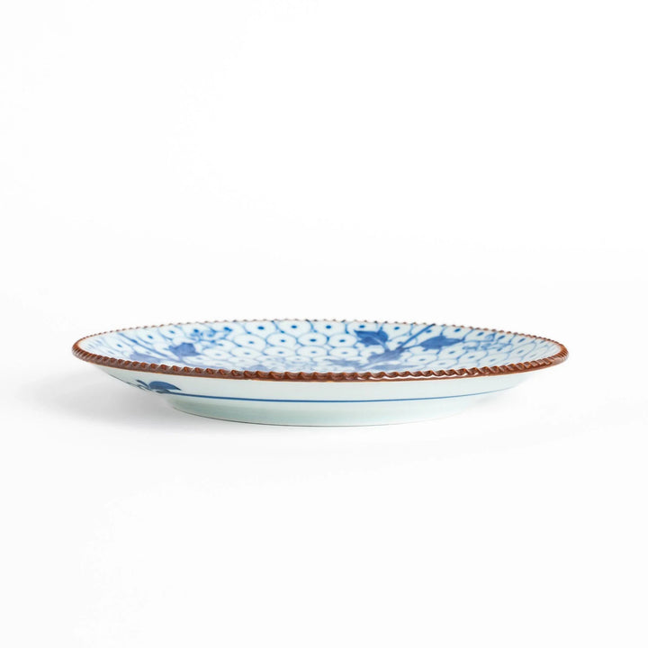 Salad Plate featuring a delicate blue spotted floral design with a beaded rim for an elegant touch.