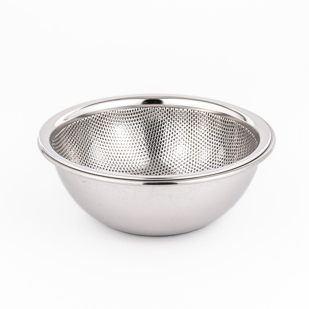 Compact stainless mesh strainer bowl with fine holes and sturdy rim, ideal for small rinsing and draining tasks.