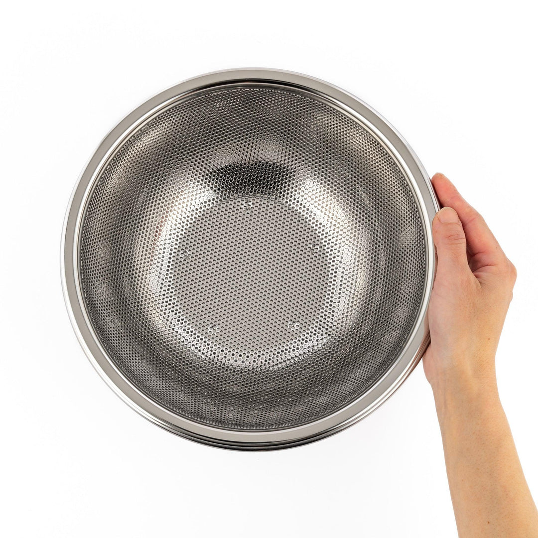 Fine stainless mesh strainer bowl with wide rim, perfect for draining noodles or rinsing rice and produce.