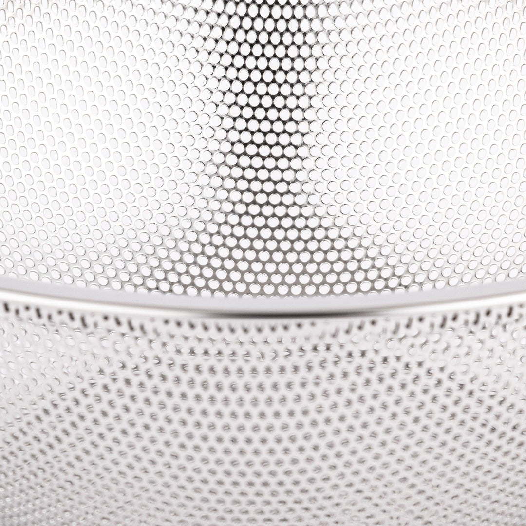 Fine stainless mesh strainer bowl with wide rim, perfect for draining noodles or rinsing rice and produce.