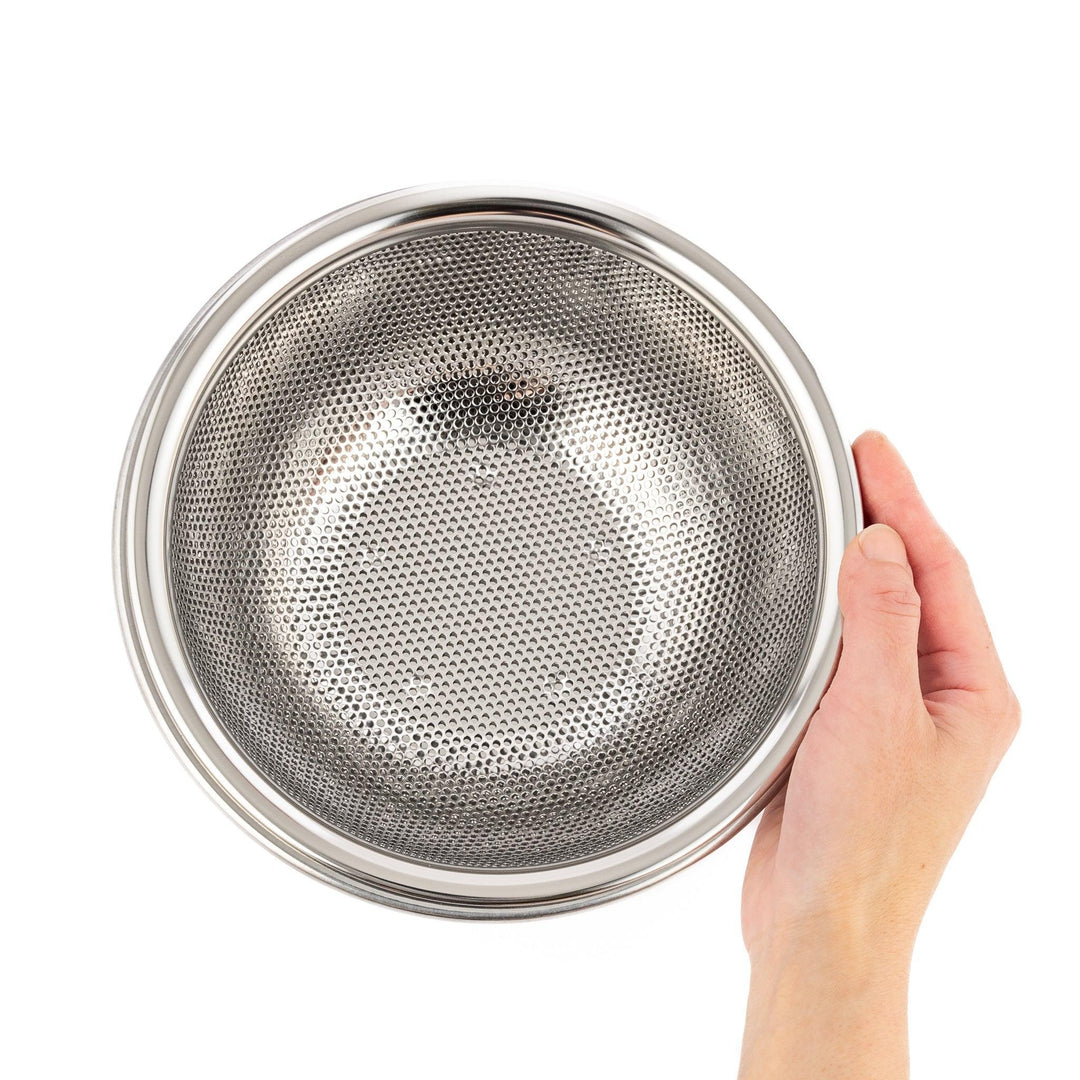 Compact stainless mesh strainer bowl with fine holes and sturdy rim, ideal for small rinsing and draining tasks.