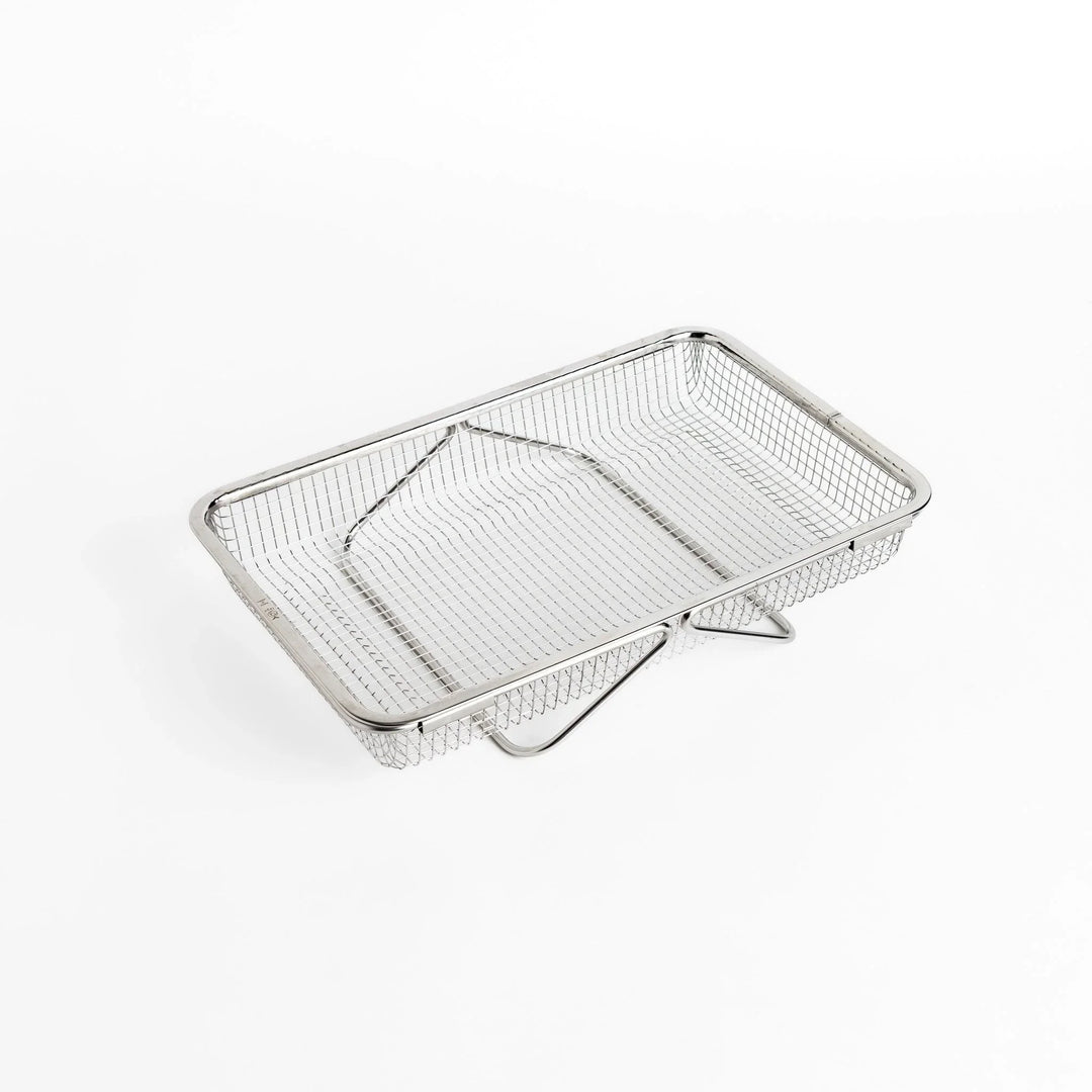 Fine mesh stainless steel draining basket, ideal for washing or draining ingredients during food preparation.