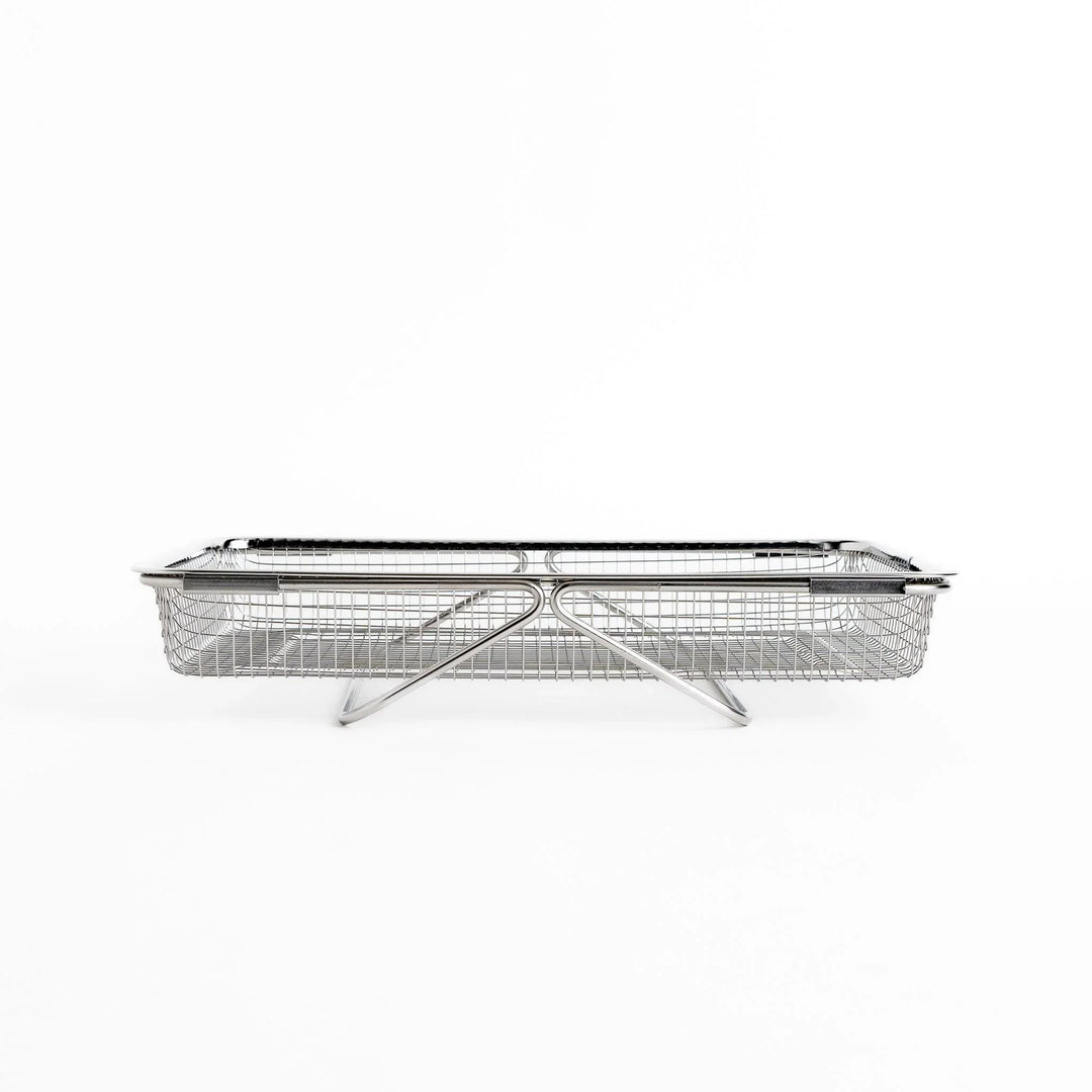 Fine mesh stainless steel draining basket, ideal for washing or draining ingredients during food preparation.