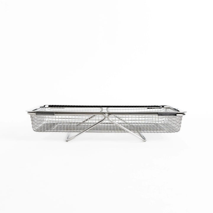 Fine mesh stainless steel draining basket, ideal for washing or draining ingredients during food preparation.