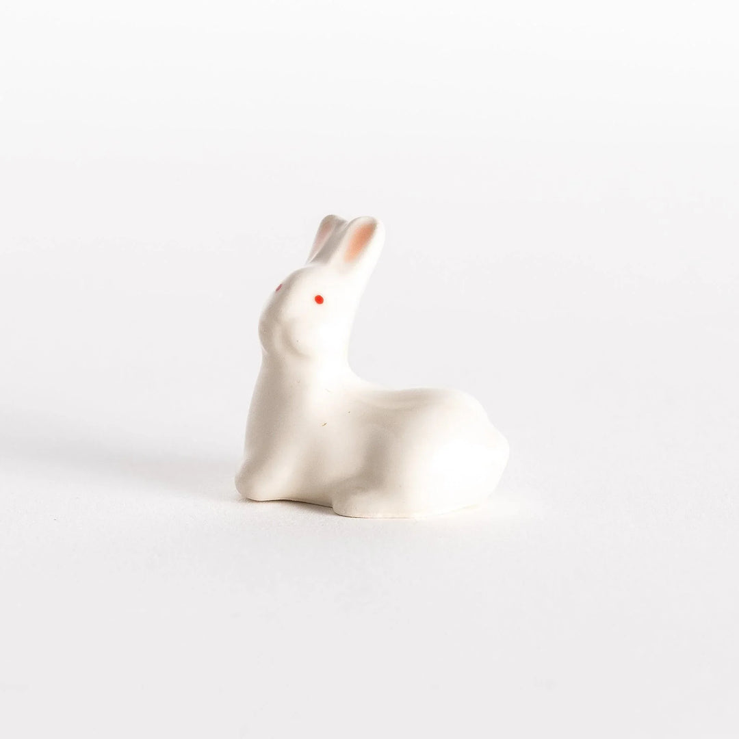 Standing rabbit shaped ceramic chopstick rest with gentle expression adding cute accent to dining.