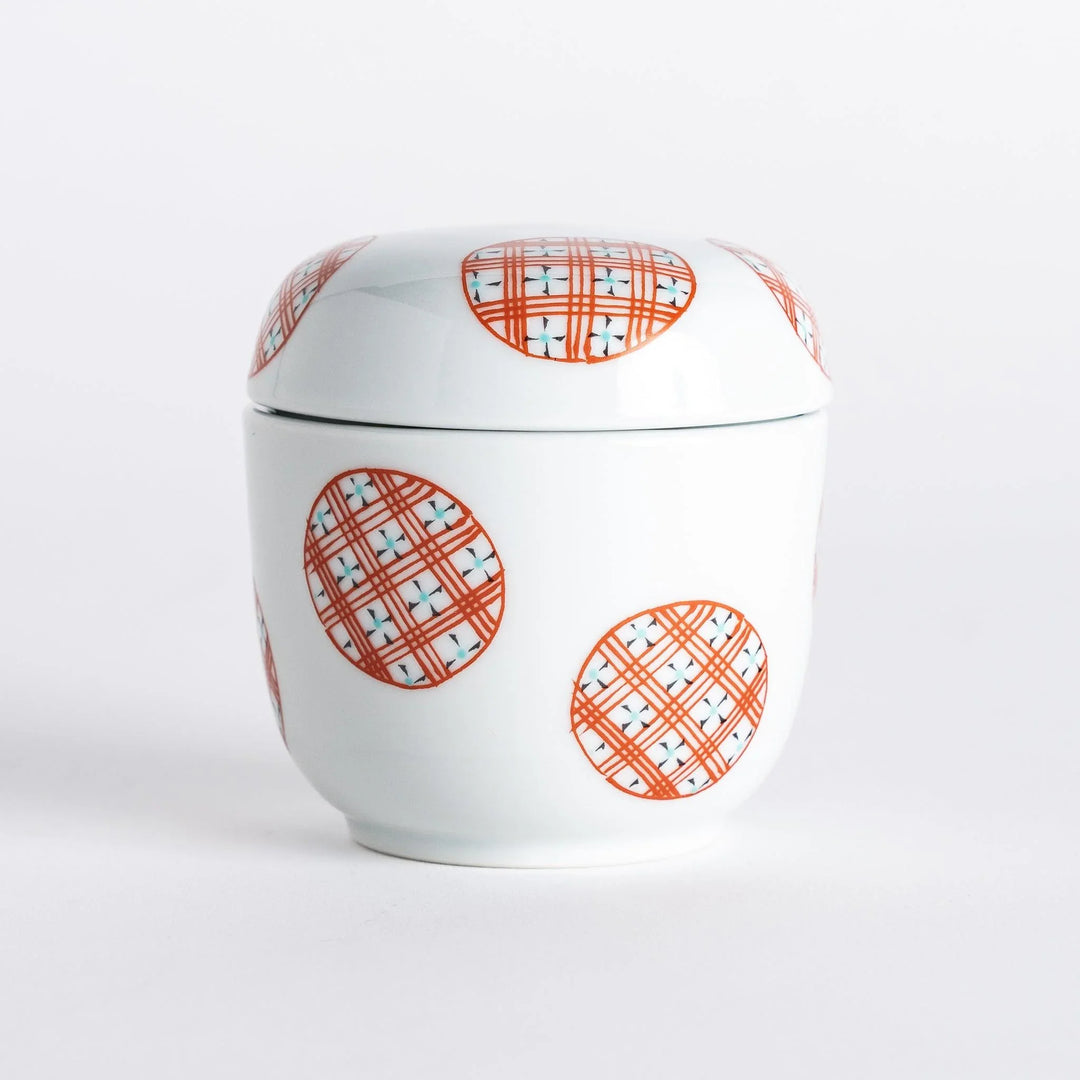 A complete view of the bowl with the lid, highlighting the unique alternating striped circle pattern.