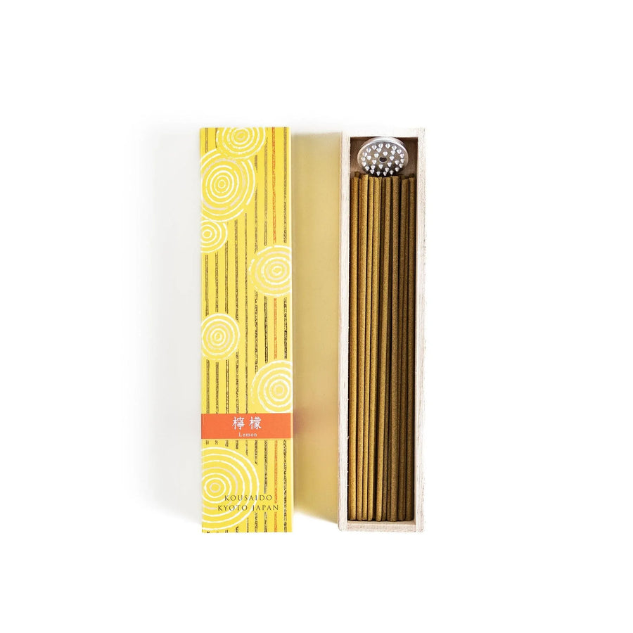 Japanese lemon incense sticks in a wooden box with a bright yellow patterned sleeve from Kyoto’s Kousaido
