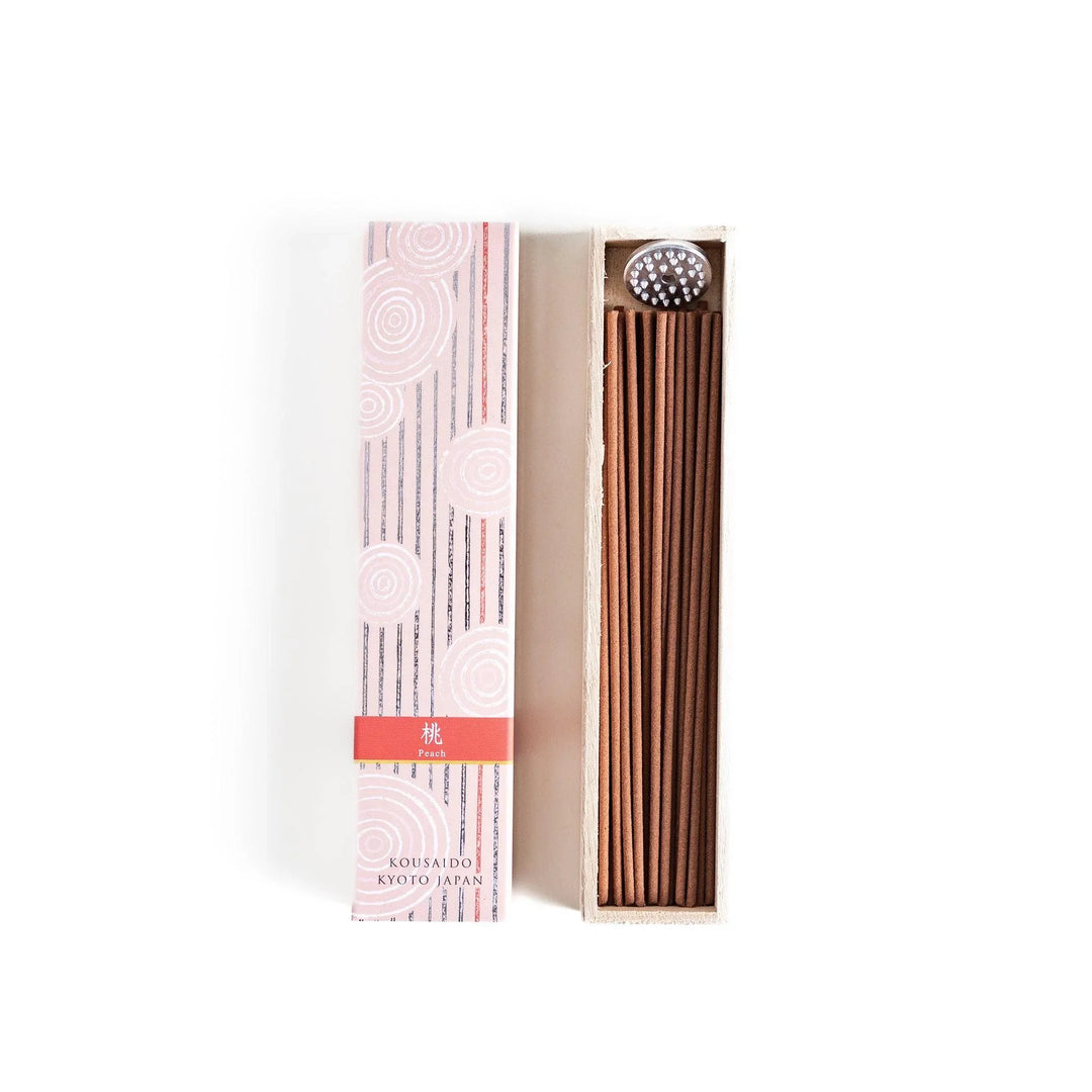 Peach scented Japanese incense sticks from Kyoto in a patterned box, offering a soft fruity aroma for a calming atmosphere.