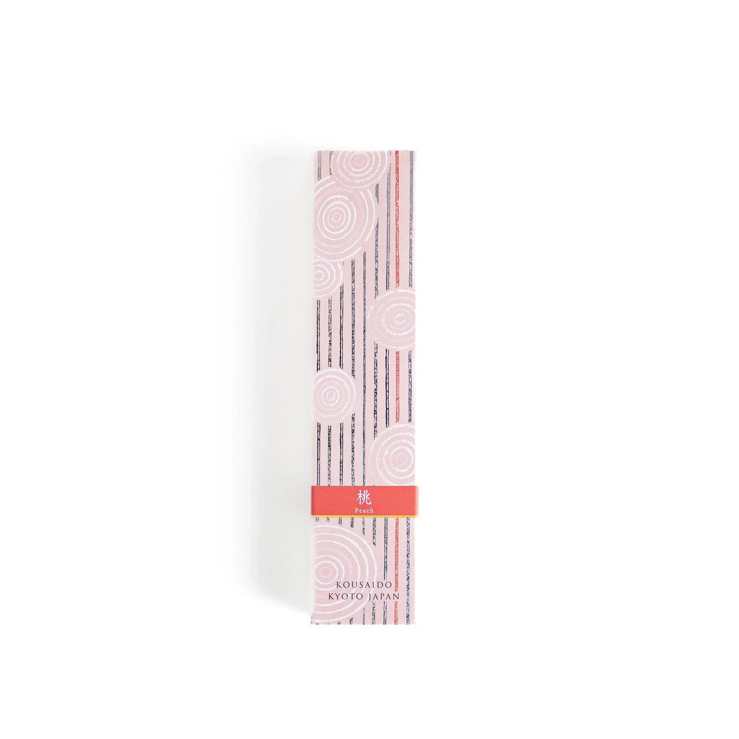 Peach scented Japanese incense sticks from Kyoto in a patterned box, offering a soft fruity aroma for a calming atmosphere.