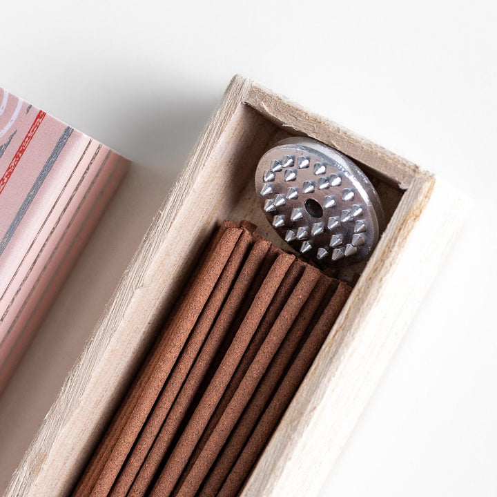 Peach scented Japanese incense sticks from Kyoto in a patterned box, offering a soft fruity aroma for a calming atmosphere.