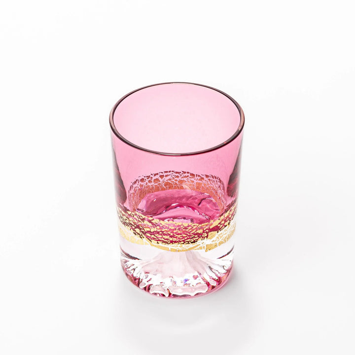 Pink sake glass with gold-leaf mountain and Mount Fuji base, perfect for festive and elegant occasions.