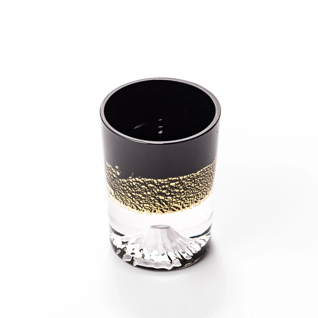Black and clear sake glass with gold-leaf landscape and Mount Fuji base, offering bold Japanese elegance.