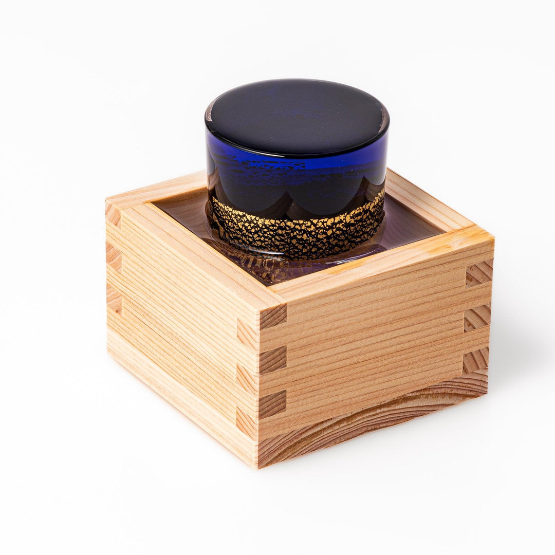 Deep blue sake glass with gold-leaf mountain and Mount Fuji base, blending traditional design with refined artistry.