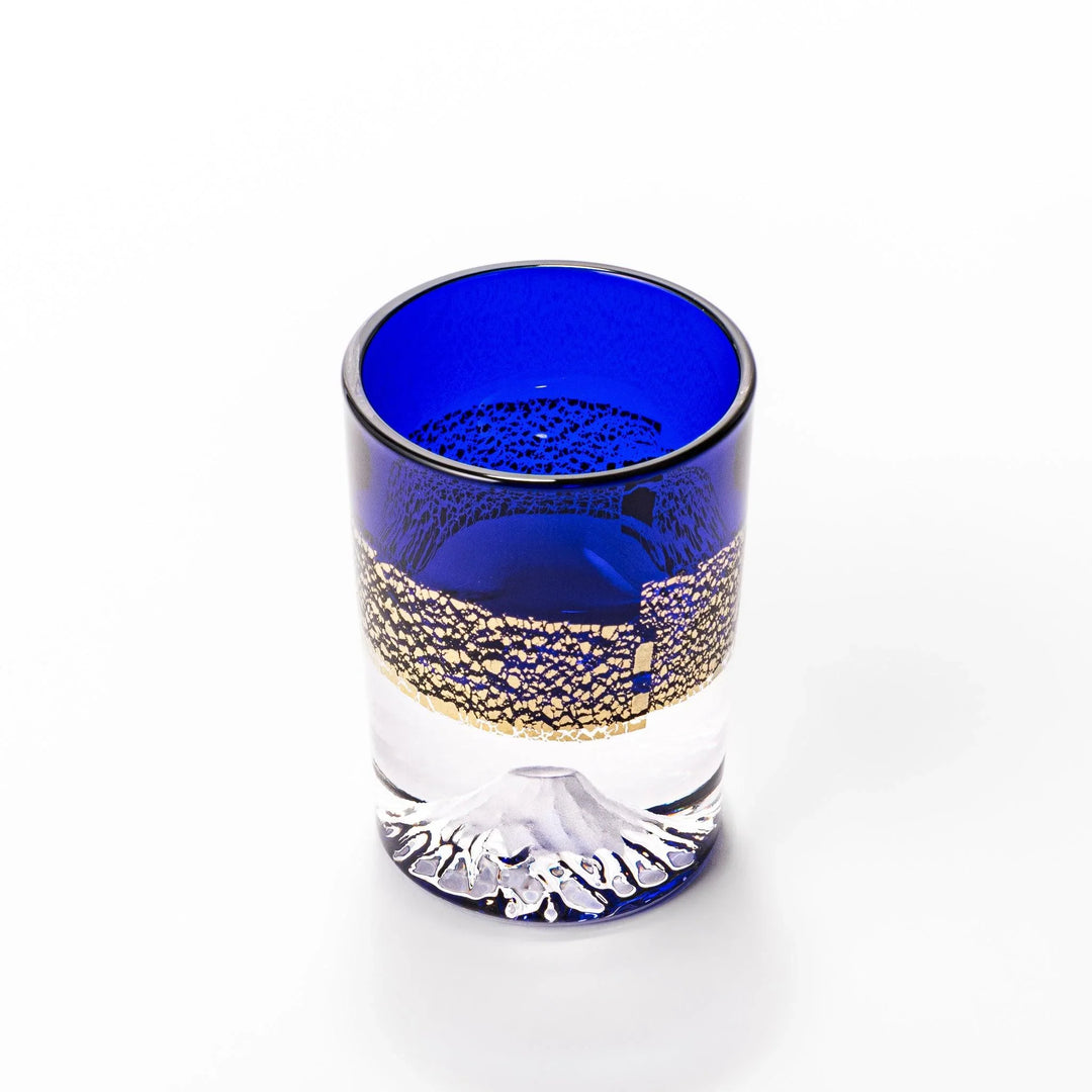 Deep blue sake glass with gold-leaf mountain and Mount Fuji base, blending traditional design with refined artistry.
