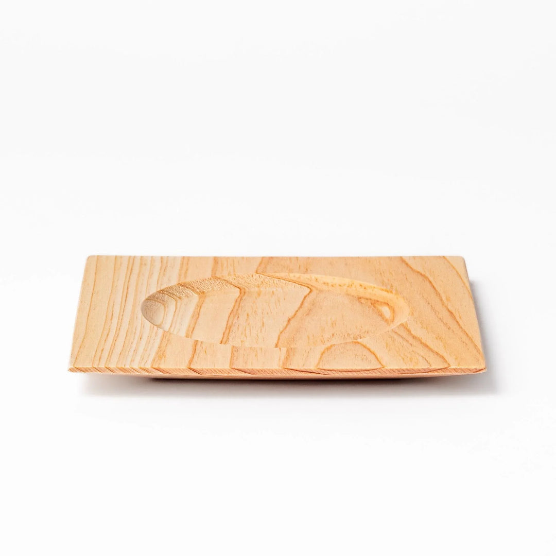 Square hinoki wood coaster with recessed circular center and beveled edge, featuring natural grain for elegant cup support.