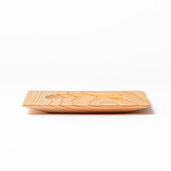 Square hinoki wood coaster with recessed circular center and beveled edge, featuring natural grain for elegant cup support.